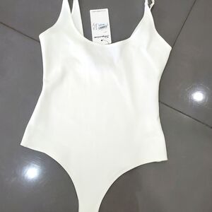 Shinestar beige bodysuit, size S